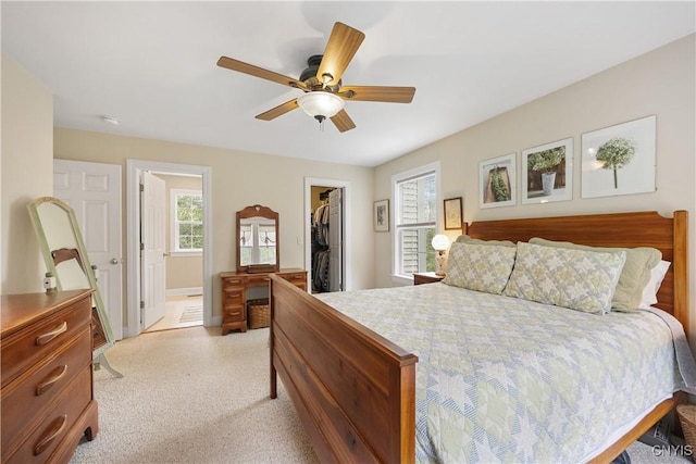 8105 Wilbarham Run, Pompey, NY 13104 - bedroom featuring a walk in closet, a closet, connected bathroom, ceiling fan, and baseboards
