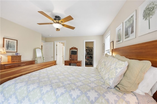 8105 Wilbarham Run, Pompey, NY 13104 - bedroom featuring a walk in closet, a ceiling fan, and a closet