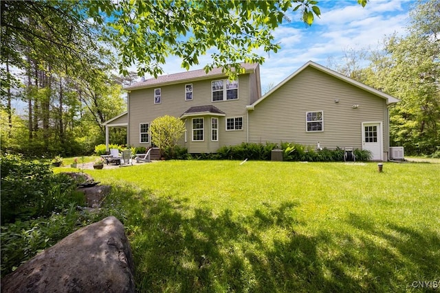 8105 Wilbarham Run, Pompey, NY 13104 - back of house with central air condition unit, a yard, a patio, and an outdoor fire pit