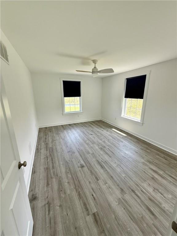 6731 County Road 12th Rd, South Bristol, NY 14512 - unfurnished room featuring healthy amount of natural light, a ceiling fan, wood finished floors, and baseboards