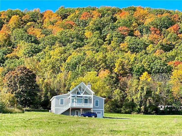 6731 County Road 12th Rd, South Bristol, NY 14512 - view of front facade with a view of trees, a front lawn, and a chimney