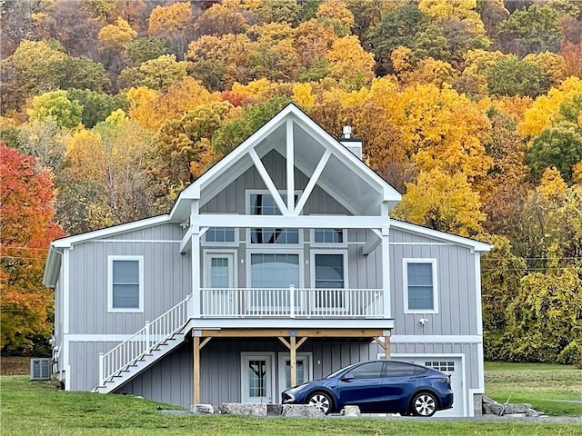 6731 County Road 12th Rd, South Bristol, NY 14512 - view of front of home with stairs, a front yard, a forest view, and a chimney
