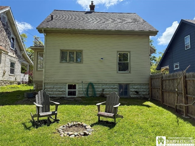 21 Juliet St, Jamestown, NY 14701 - back of house featuring a chimney, an outdoor fire pit, and a shingled roof