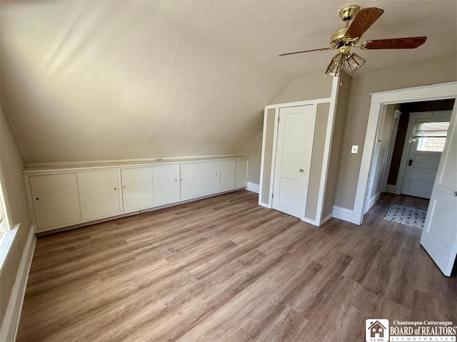 21 Juliet St, Jamestown, NY 14701 - additional living space with ceiling fan, lofted ceiling, light wood finished floors, and baseboards