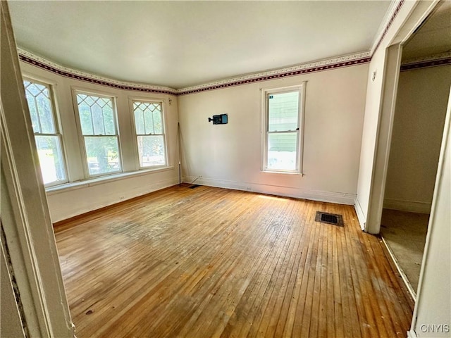 3628 S Salina St, Syracuse, NY 13205 - empty room featuring hardwood / wood-style floors and baseboards