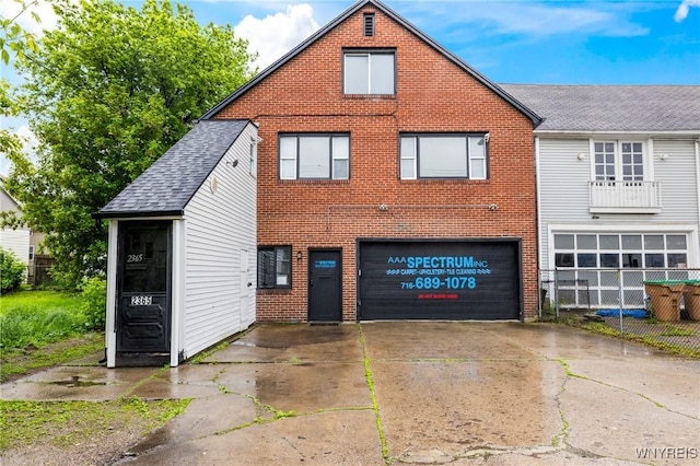 2365 Genesee St, Cheektowaga, NY 14225 - view of front of house with a garage, brick siding, and concrete driveway