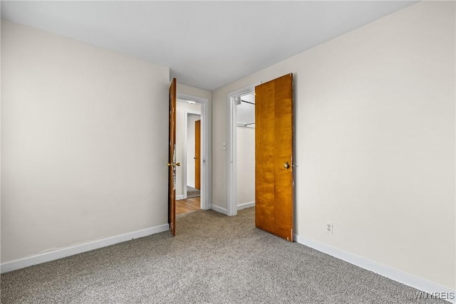 2365 Genesee St, Cheektowaga, NY 14225 - unfurnished bedroom featuring light carpet and baseboards