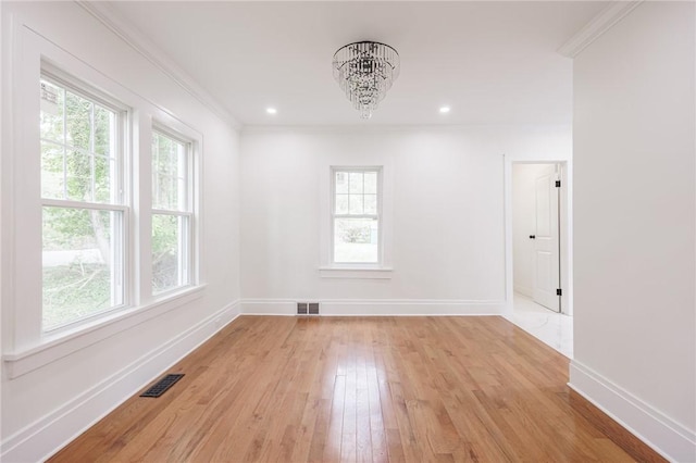 636 Ridge Rd, Webster, NY 14580 - spare room featuring a chandelier, plenty of natural light, baseboards, crown molding, and recessed lighting
