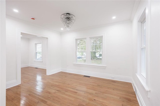636 Ridge Rd, Webster, NY 14580 - empty room with a chandelier, crown molding, light wood-style floors, baseboards, and recessed lighting