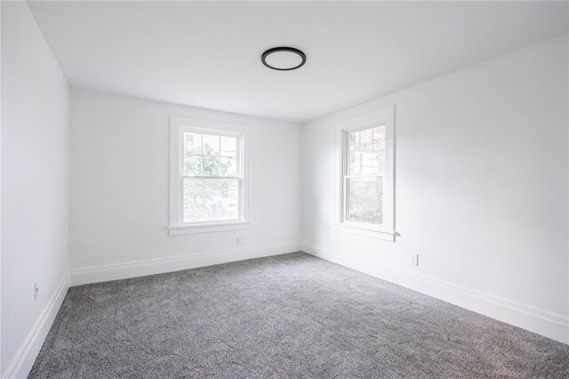 636 Ridge Rd, Webster, NY 14580 - carpeted spare room with baseboards