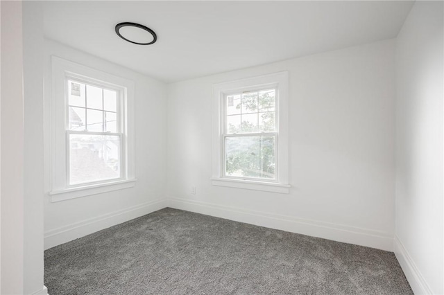 636 Ridge Rd, Webster, NY 14580 - unfurnished room with dark carpet and baseboards