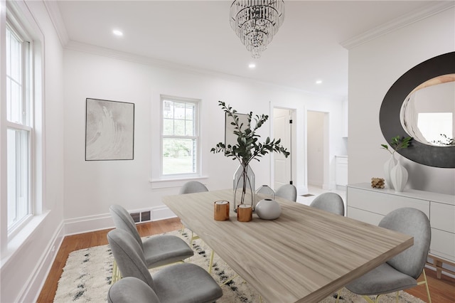636 Ridge Rd, Webster, NY 14580 - dining room with ornamental molding, wood finished floors, recessed lighting, and baseboards