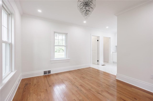 636 Ridge Rd, Webster, NY 14580 - spare room with light wood-style flooring, ornamental molding, a chandelier, baseboards, and recessed lighting