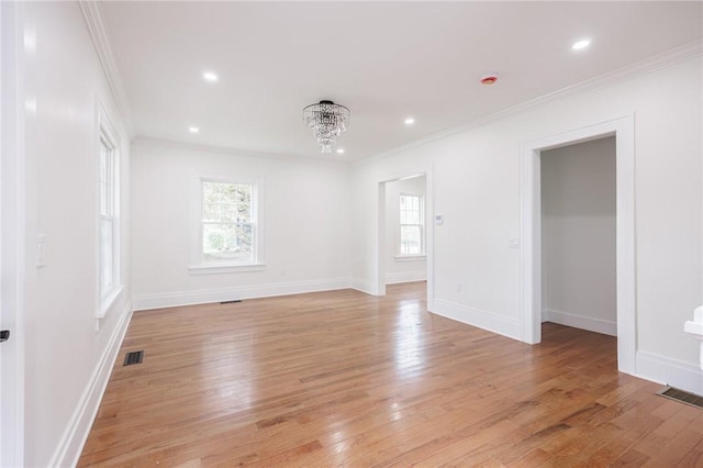 636 Ridge Rd, Webster, NY 14580 - unfurnished room featuring healthy amount of natural light, ornamental molding, light wood-style flooring, a chandelier, and recessed lighting