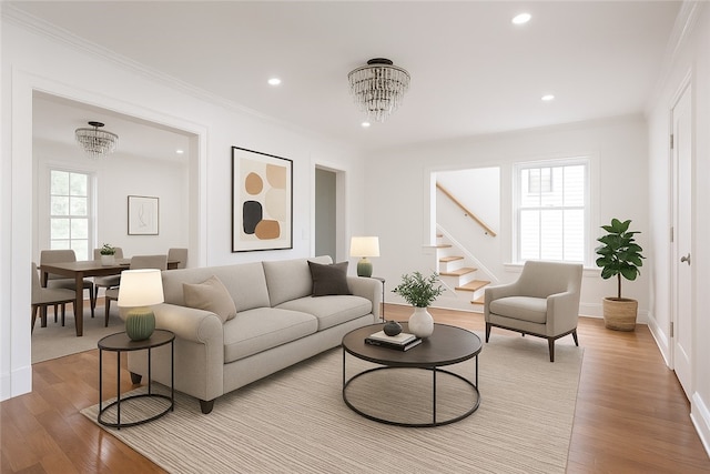 636 Ridge Rd, Webster, NY 14580 - living room with a chandelier, stairway, light wood-style floors, recessed lighting, and crown molding