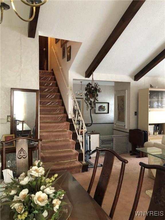 148 Marlin Rd, Grand Island, NY 14072 - stairs with beamed ceiling, carpet floors, and a high ceiling