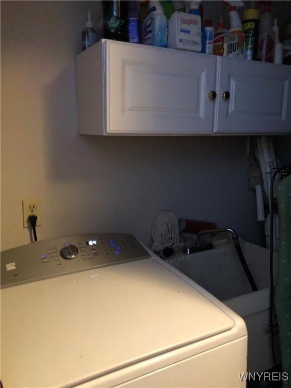 148 Marlin Rd, Grand Island, NY 14072 - washroom with washer / clothes dryer and cabinet space