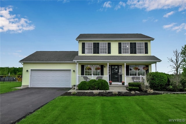 4343 Lockport Rd, Cambria, NY 14094 - view of front of house featuring asphalt driveway, a porch, a garage, and a front yard
