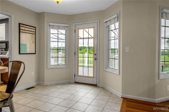4343 Lockport Rd, Cambria, NY 14094 - doorway featuring baseboards and light tile patterned floors