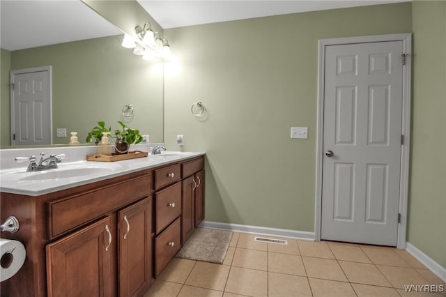 4343 Lockport Rd, Cambria, NY 14094 - bathroom featuring double vanity, tile patterned floors, and baseboards