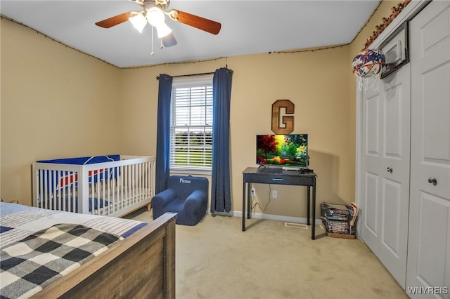 4343 Lockport Rd, Cambria, NY 14094 - bedroom with light colored carpet, baseboards, ceiling fan, and a closet