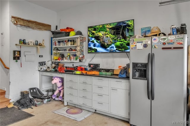 4343 Lockport Rd, Cambria, NY 14094 - kitchen featuring stainless steel fridge, open shelves, white cabinets, concrete floors, and dark countertops