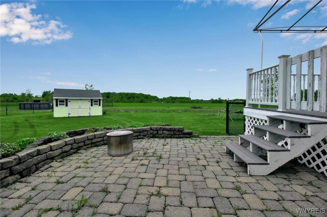 4343 Lockport Rd, Cambria, NY 14094 - view of patio featuring an outdoor structure, a deck, and a view of countryside