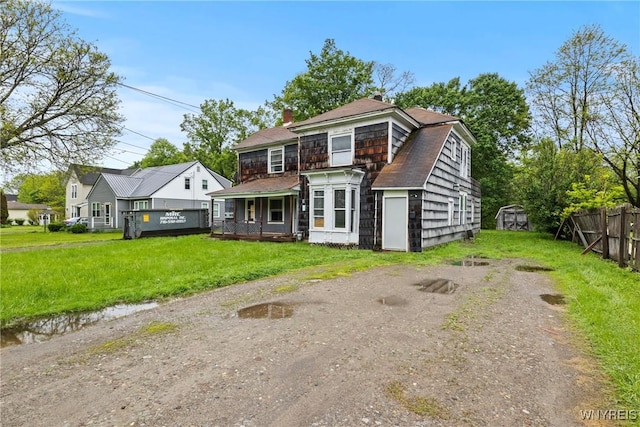 227 Mill St, Concord, NY 14141 - rear view of house with roof with shingles and a chimney
