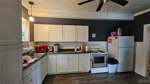 55 Lewis St, Buffalo, NY 14206 - kitchen with white appliances, ornamental molding, white cabinets, dark countertops, and a sink