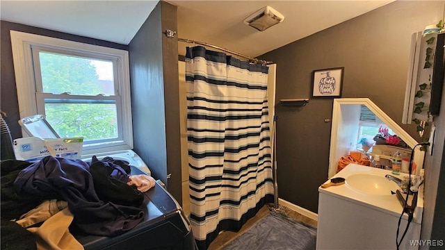 55 Lewis St, Buffalo, NY 14206 - full bathroom featuring vanity, lofted ceiling, and a shower with curtain