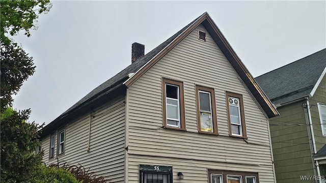 55 Lewis St, Buffalo, NY 14206 - view of property exterior with a chimney