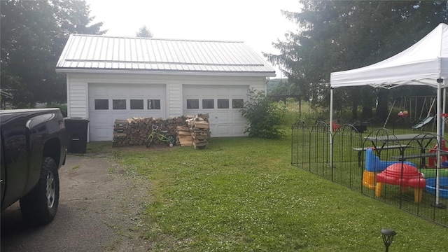 31 S Main St, Cohocton, NY 14826 - view of grassy yard with an outbuilding and a garage