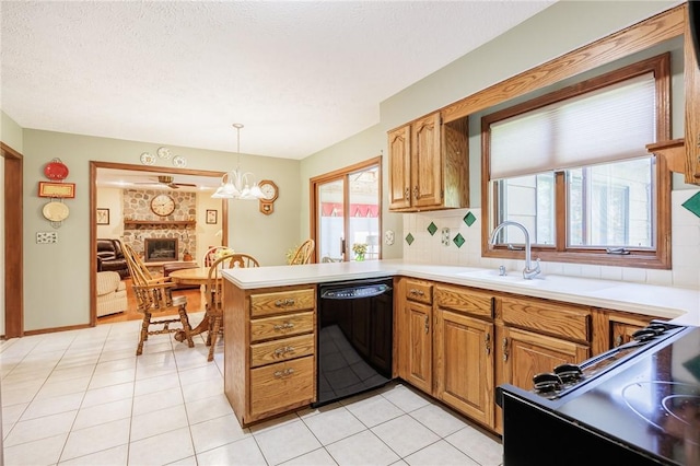 144 Guygrace Ln, Penfield, NY 14580 - kitchen with dishwasher, plenty of natural light, a peninsula, and brown cabinetry