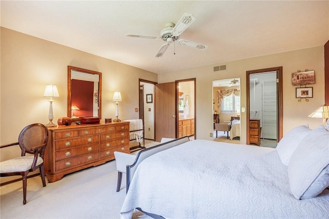 144 Guygrace Ln, Penfield, NY 14580 - bedroom with light carpet, ceiling fan, and connected bathroom