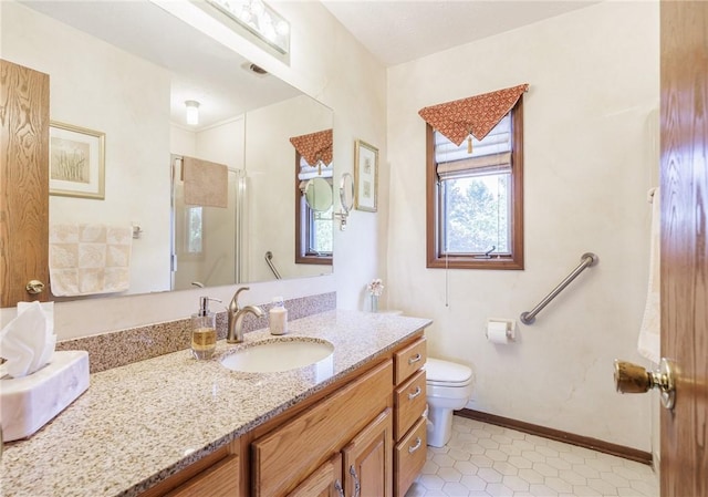 144 Guygrace Ln, Penfield, NY 14580 - full bathroom featuring vanity, a shower stall, toilet, tile patterned floors, and baseboards
