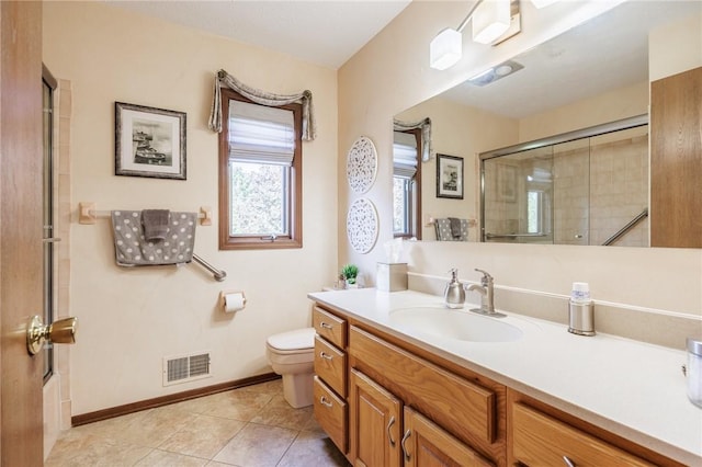 144 Guygrace Ln, Penfield, NY 14580 - bathroom featuring toilet, an enclosed shower, vanity, tile patterned floors, and baseboards