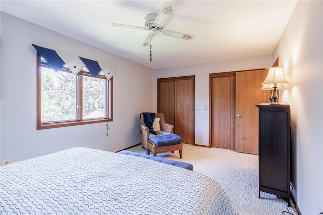 144 Guygrace Ln, Penfield, NY 14580 - carpeted bedroom featuring multiple closets and a ceiling fan