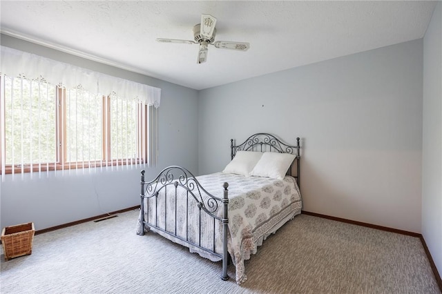 144 Guygrace Ln, Penfield, NY 14580 - bedroom with carpet, baseboards, and a ceiling fan