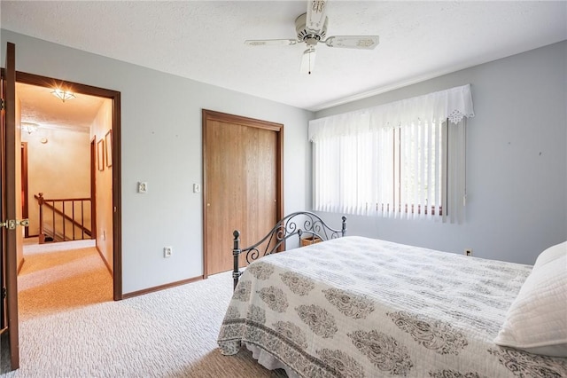 144 Guygrace Ln, Penfield, NY 14580 - bedroom featuring carpet, a closet, baseboards, and a ceiling fan