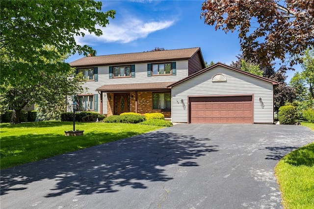 144 Guygrace Ln, Penfield, NY 14580 - view of front of home with driveway, an attached garage, and a front yard