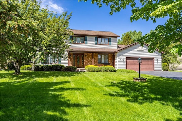 144 Guygrace Ln, Penfield, NY 14580 - view of front facade with an attached garage, asphalt driveway, a front lawn, covered porch, and brick siding
