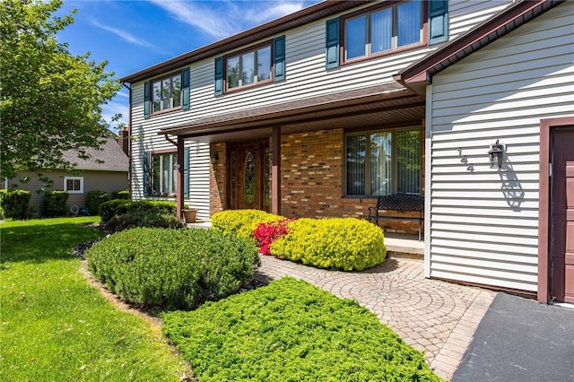 144 Guygrace Ln, Penfield, NY 14580 - view of front of property featuring brick siding and a front lawn