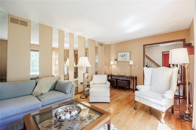 144 Guygrace Ln, Penfield, NY 14580 - living area featuring wood finished floors and stairs