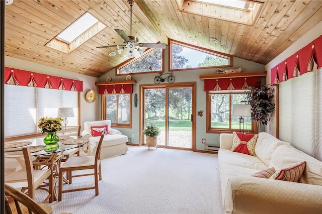 144 Guygrace Ln, Penfield, NY 14580 - living room with a skylight, vaulted ceiling, carpet flooring, ceiling fan, and baseboards