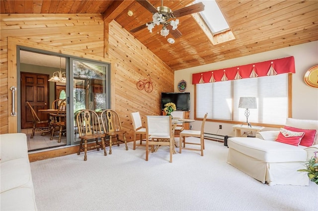 144 Guygrace Ln, Penfield, NY 14580 - carpeted living room featuring wood ceiling, wood walls, ceiling fan, and a skylight