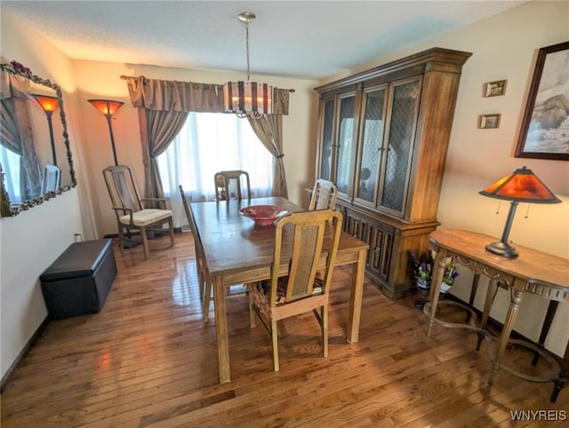 589 Briarwood Ln, Lewiston, NY 14092 - dining area featuring a chandelier and wood finished floors