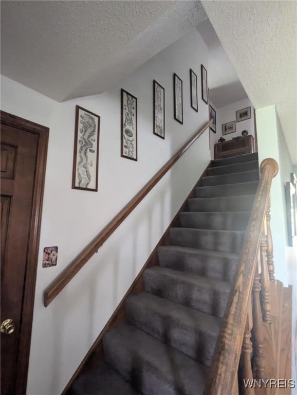 589 Briarwood Ln, Lewiston, NY 14092 - stairs with a textured ceiling