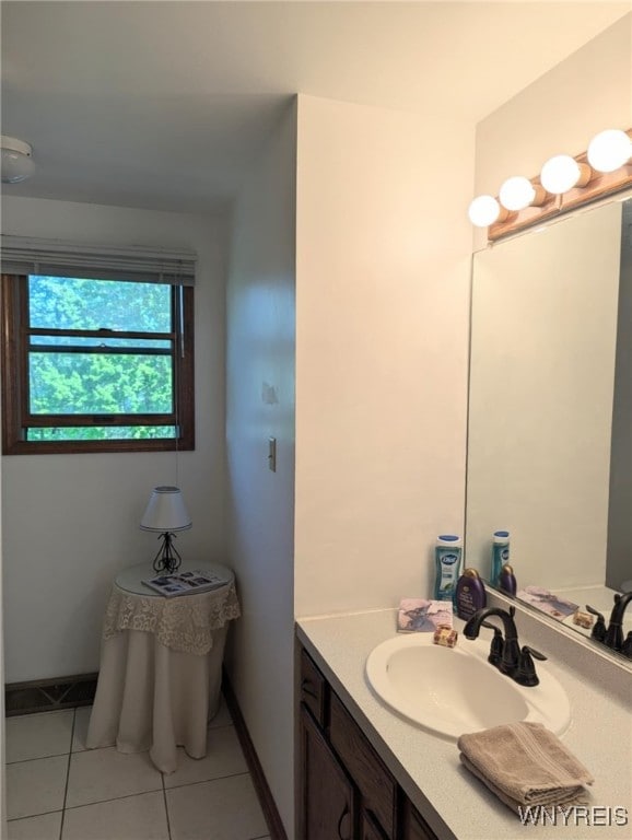589 Briarwood Ln, Lewiston, NY 14092 - bathroom with vanity, tile patterned flooring, and baseboards