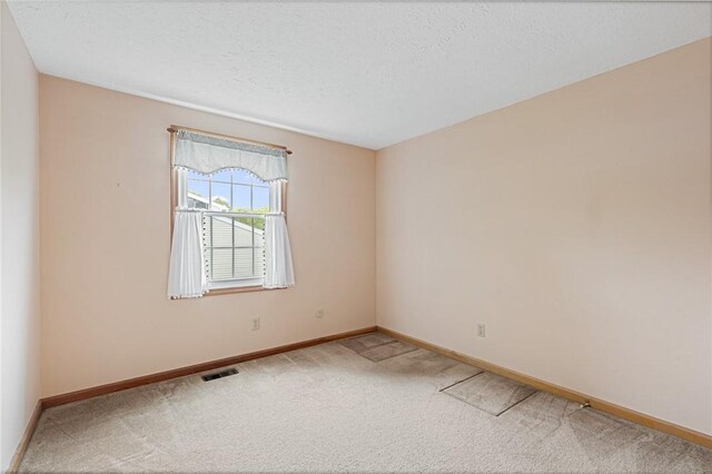 194 Citation Dr, Henrietta, NY 14467 - carpeted empty room featuring baseboards and a textured ceiling