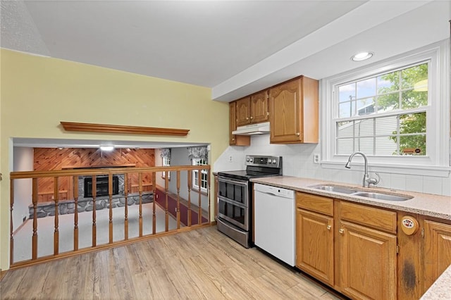 194 Citation Dr, Henrietta, NY 14467 - kitchen with dishwasher, range with two ovens, a sink, under cabinet range hood, and light wood-type flooring